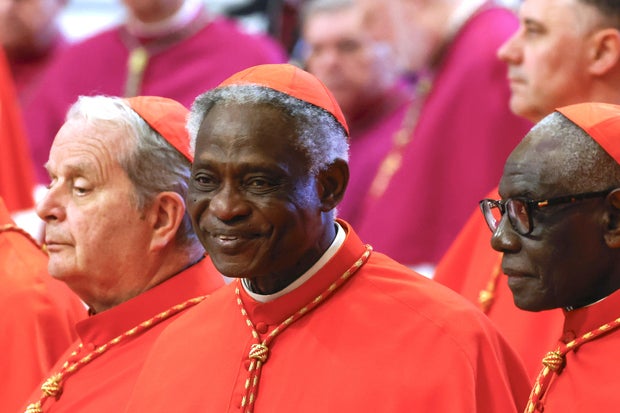Cardinal Peter Turkson of Ghana pays his respects to the body of Pope Francis in St. Peter's Basilica, at the Vatican, April 23, 2025.