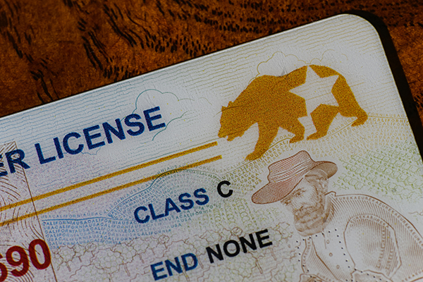 Lake Elsinore, California, USA - Dec 18, 2022: Closeup of California Real ID driver license focusing on the REAL ID logo