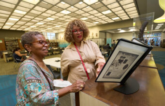Black Californians Invited to Share Their Stories Through New Community Oral History Initiative Exhibit curator Kellie Todd Griffin shares the Museum of Black Women and Girls Pop-Up with an oral history project participant at the A C Bilbrew Library.